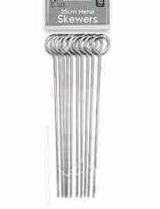 metal skewers on white background